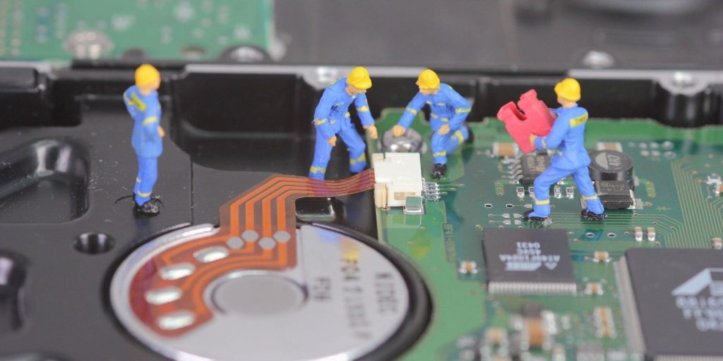 Miniature Figures Fixing A Computer.jpg