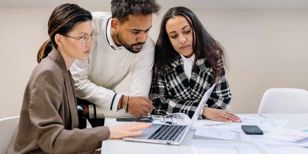 Man And Women Looking At A Laptop.jpg