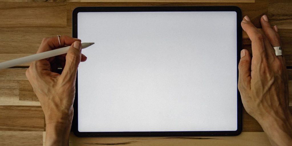 Person Using Apple Pencil With An Ipad.jpg