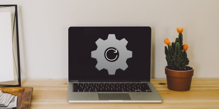 Gray Laptop On A Wooden Table.jpg