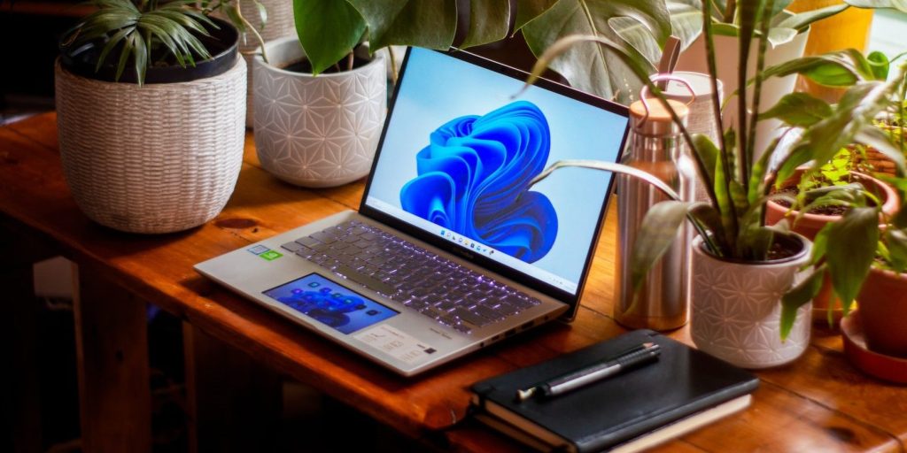 Windows 11 laptop on a wooden table.jpg