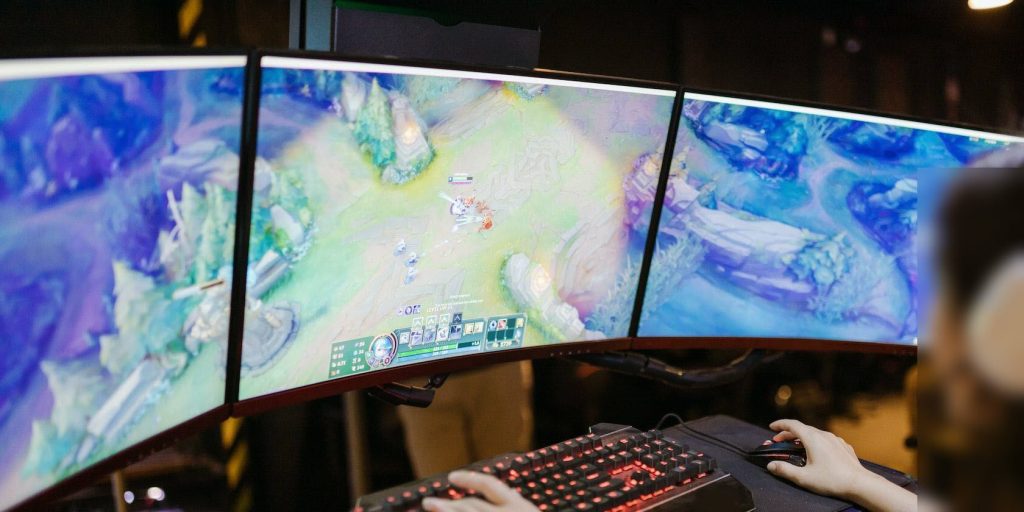 Woman playing league of legends on a pc.jpg