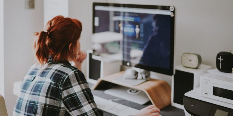 A Woman Usin A Desktop Computer 1.jpg