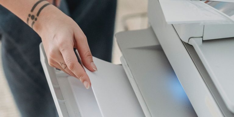 A Person Printing On A Printer.jpg