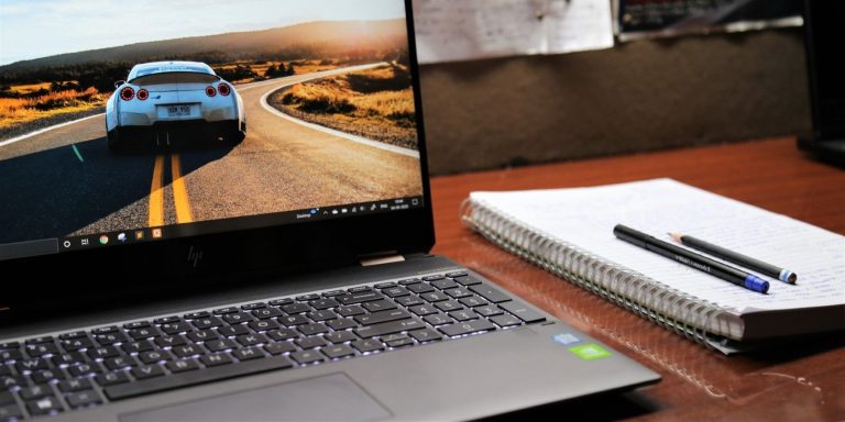 A Black Windows Laptop On A Wooden Table.jpg