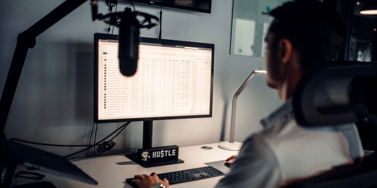 Man With Microphone On Computer.jpg