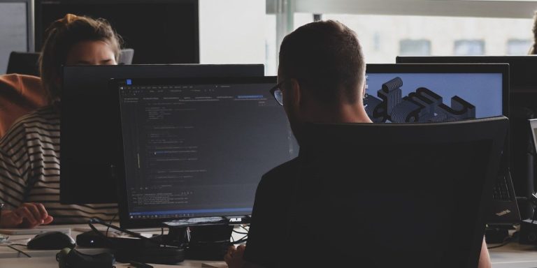 People Working On Computers At Their Desk.jpg