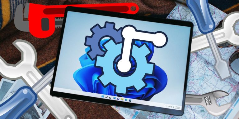 A Windows Tablet Pc With Vector Tools And Gears Around It.jpg