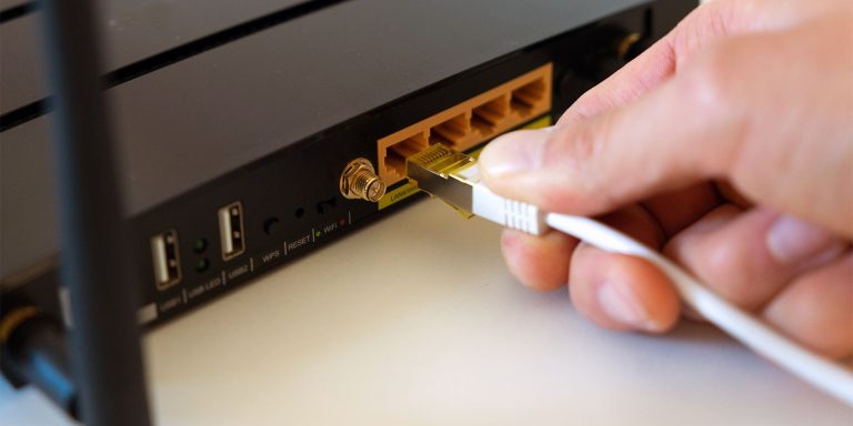 Connecting A Lan Cable To A Router To Update It.jpg